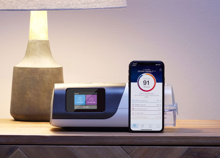 airsense 11 on a nightstand with phone at night